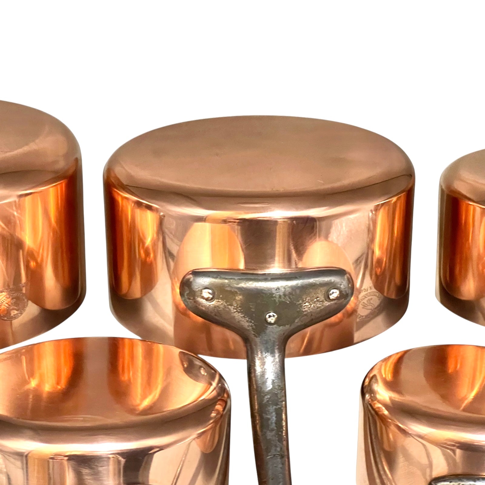 Set of copper pots and on a white background