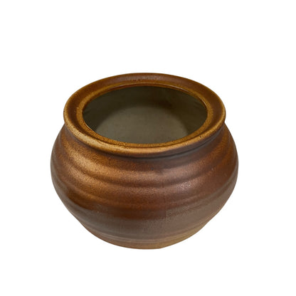 Close-up of a ceramic container with 'Olive' engraved on it, on a white background.