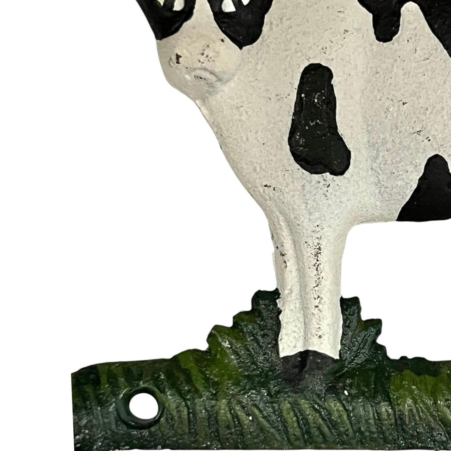Close-up of a cow-shaped toiler paper roll holder  on a white background