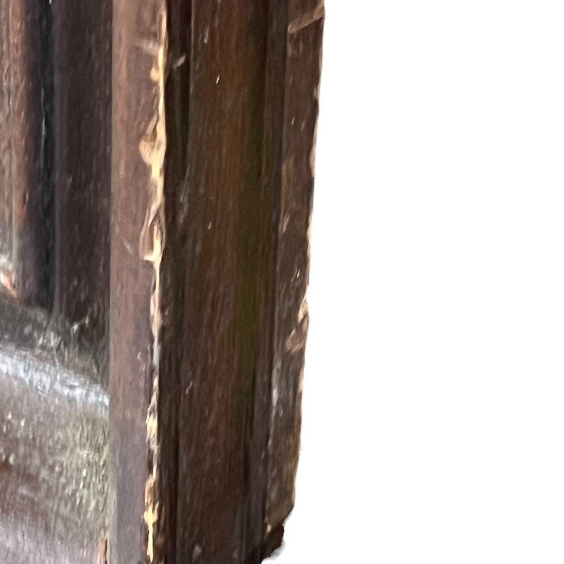 Close-up of a dark brown wooden frame corner showing the wood grain and worn edges against a white background.