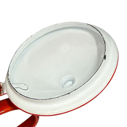 Close-up of a red teapot on a white background