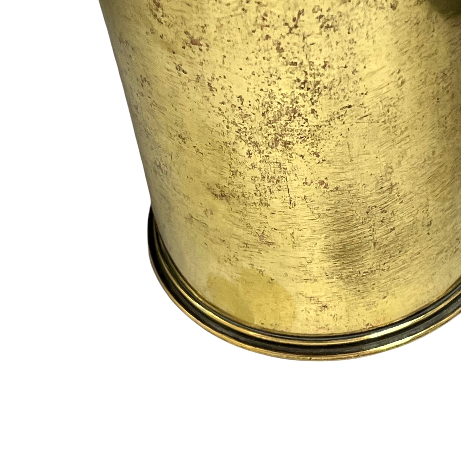 Close-up of a brass trench art shell case on a white background 