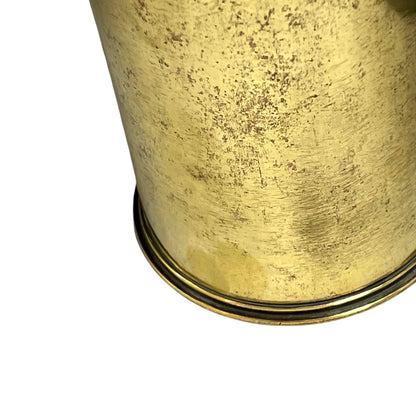 Close-up of a brass trench art shell case on a white background 