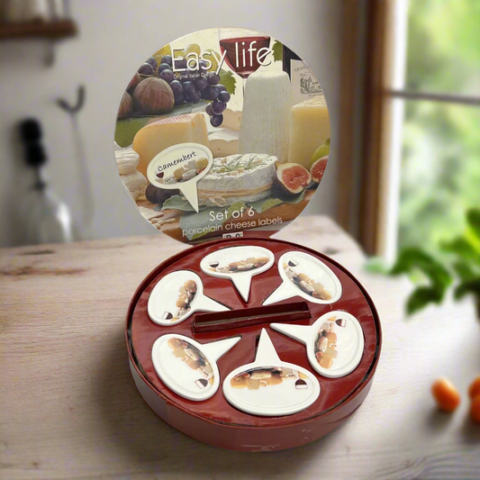 Set of 6 decorative cheese labels in a circular packaging on a wooden surface.