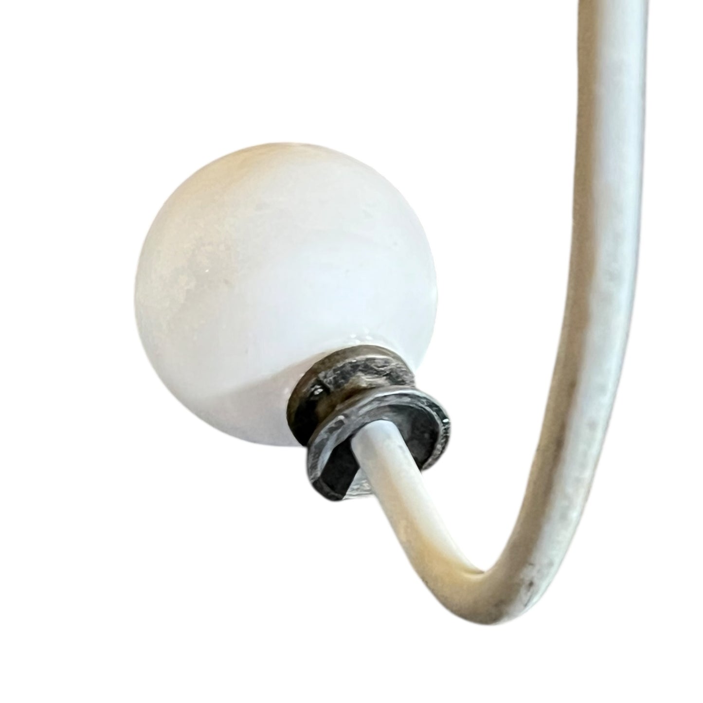 Close-up of a metal she with visible wear and tear on a white background