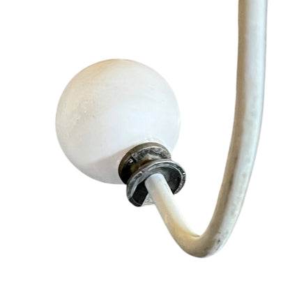 Close-up of a metal she with visible wear and tear on a white background