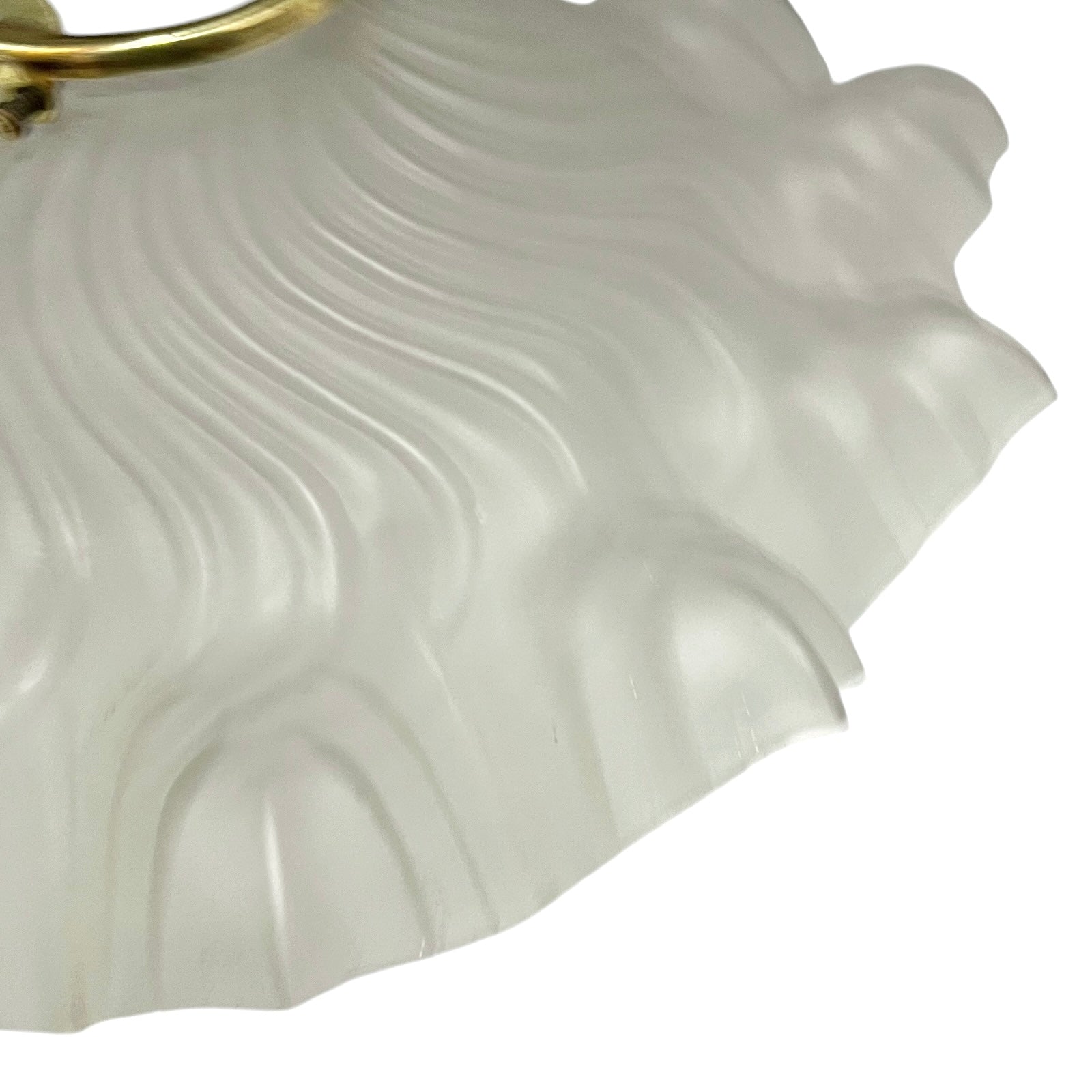 Close up of a glass lampshade on a white background 