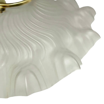 Close up of a glass lampshade on a white background 