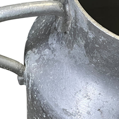 Close-up of a grey milk churn on a white background
