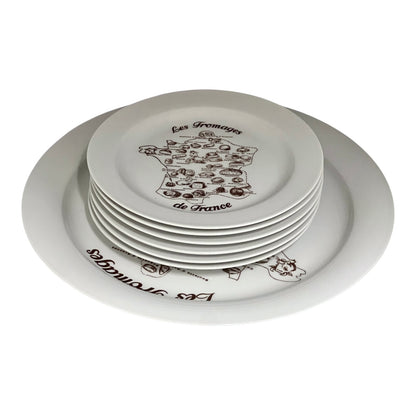 Set of white plates with black text and graphics on a white background
