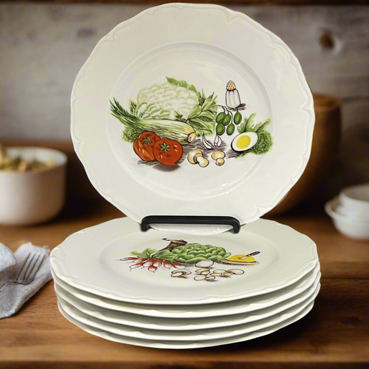 Set of 6 white porcelain plates with vegetable illustrations on a wooden surface on a rustic kitchen