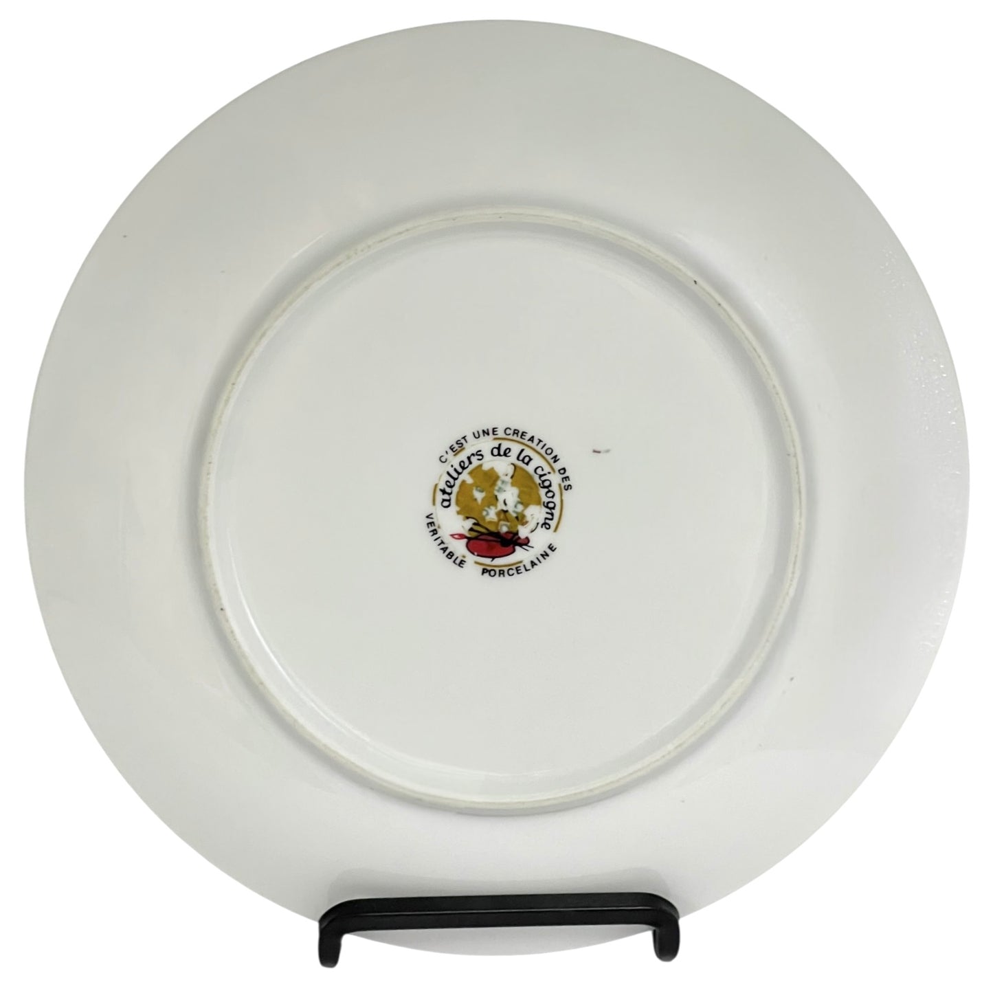 White plate with a logo and text on a stand against a white background