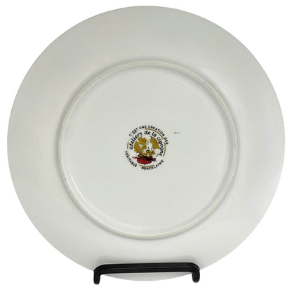 White plate with a logo and text on a stand against a white background