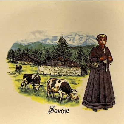Illustration of a woman with cows in a mountainous landscape, labeled 'Savoie'.