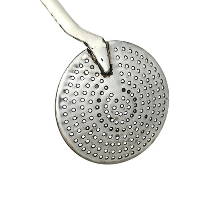close up of a vintage kitchen utensil on a white background