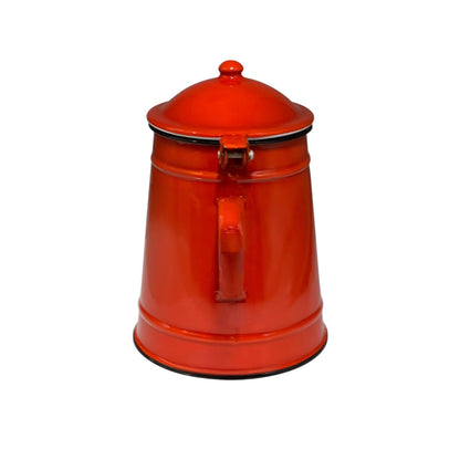 Red vintage enamel teapot on a white background