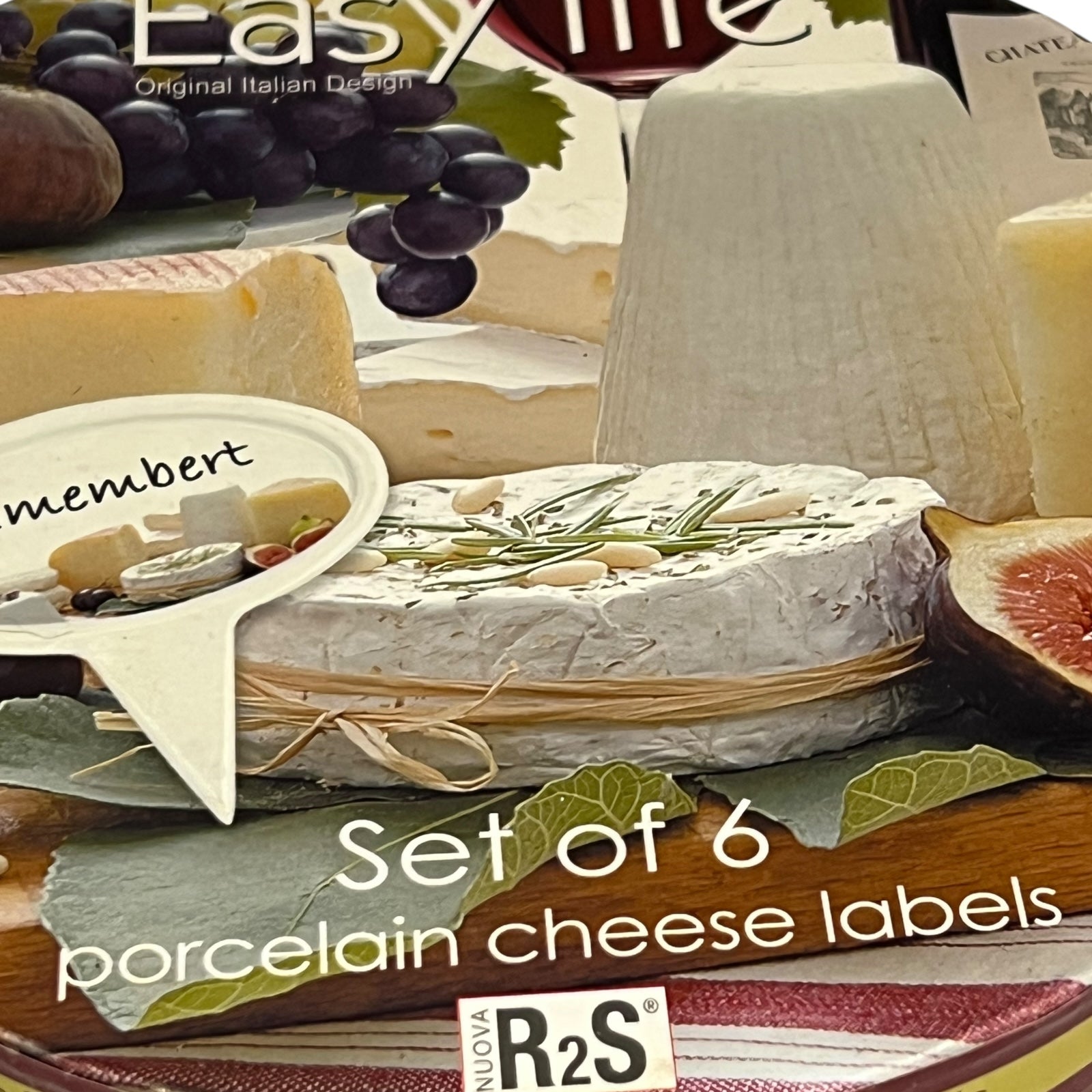 Close up of a porcelain cheese label in a red box on a white background