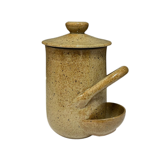 A speckled ceramic jar with a matching lid and an integrated pouring spout and small bowl, shown on a plain white background.