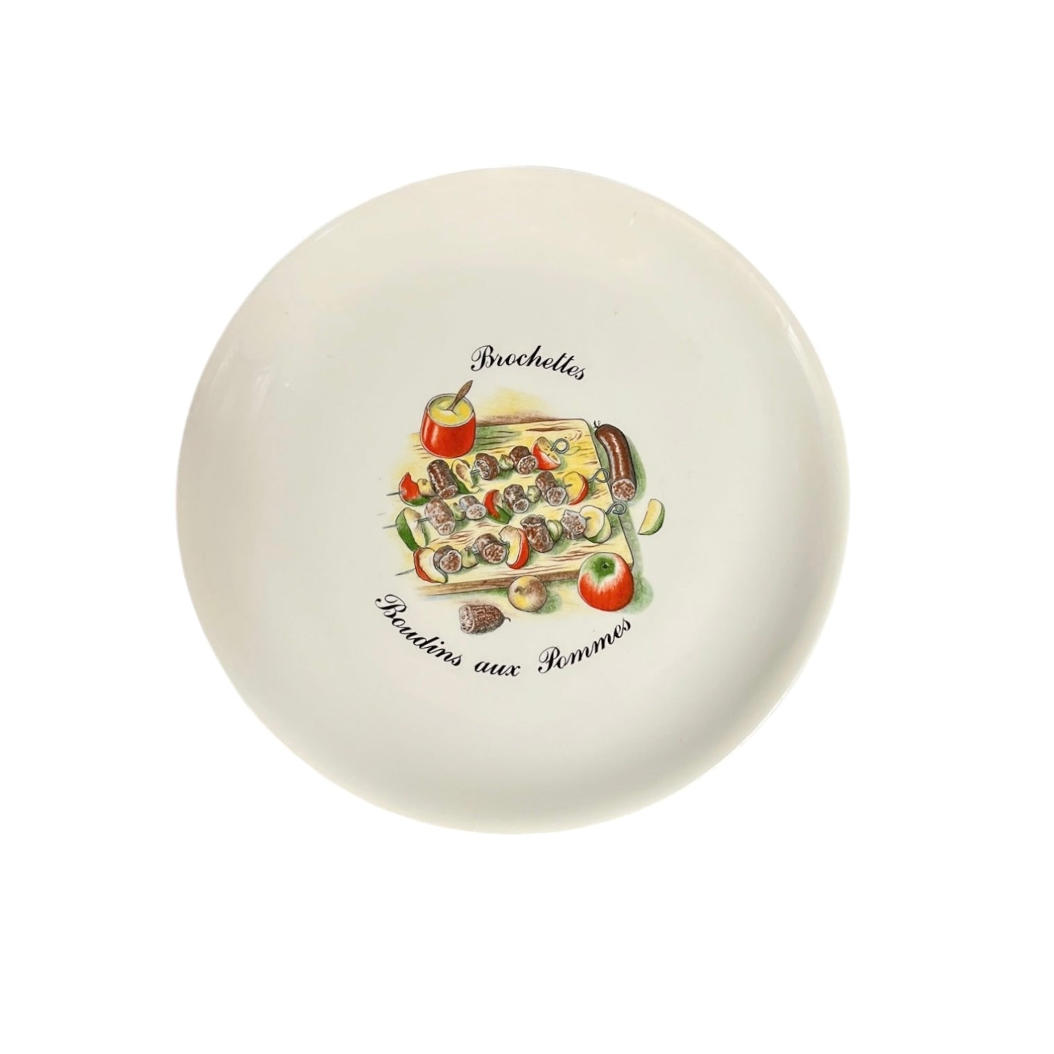 Round ceramic plate with decorative fruit illustration on a white background