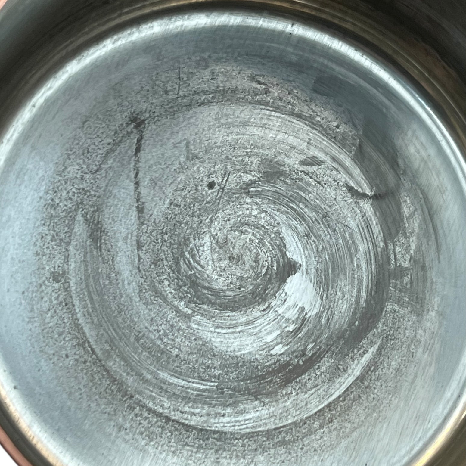 close up of copper pan tin lined inner