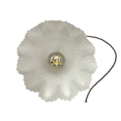 A French vintage Art Deco-style lampshade made of clear frosted glass with a frilled edge, with twisted-style wiring and brass fittings, perfect for adding charm to a period room or retro home, displayed against a white background.