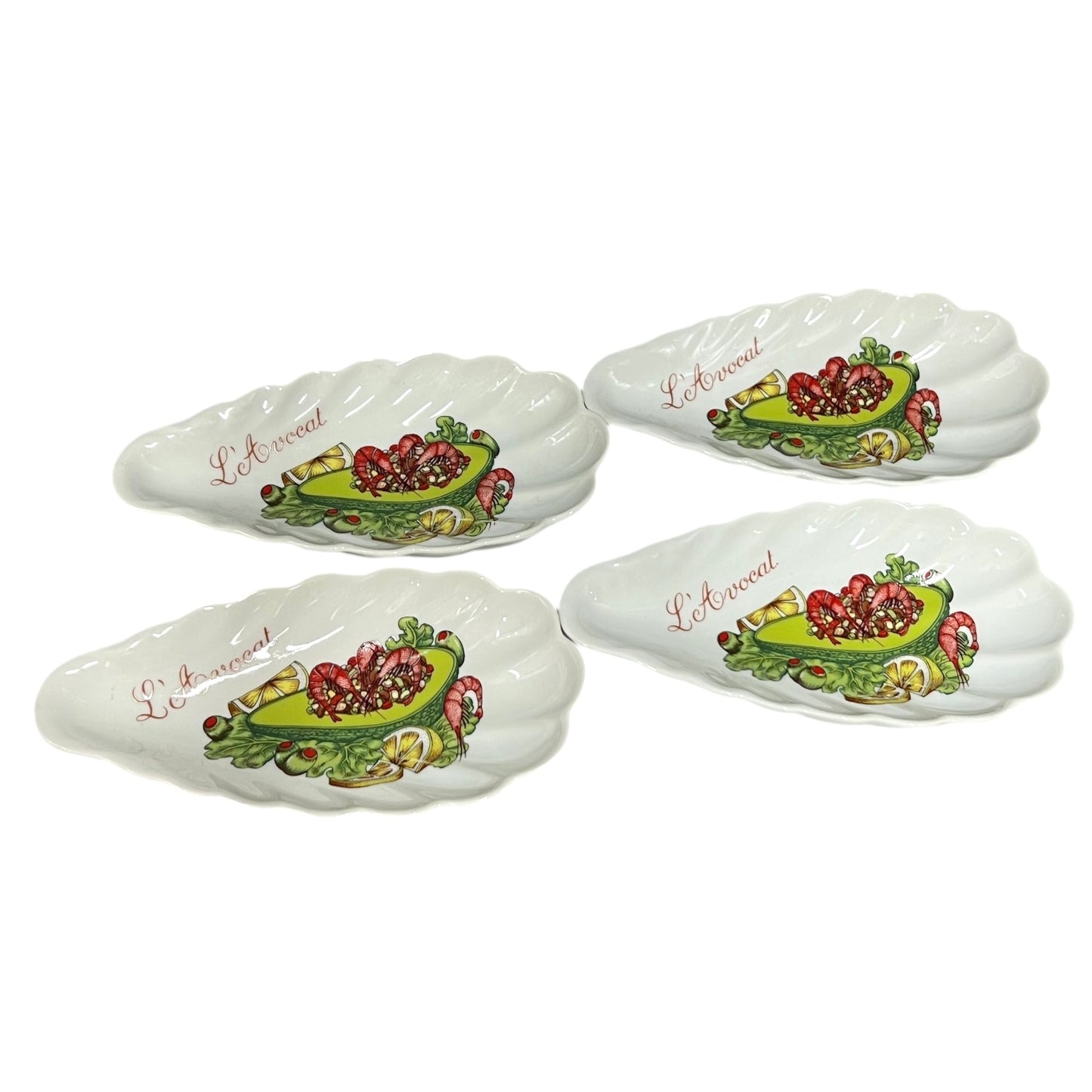 Set of shell-shaped porcelain avocado dishes  decorative designs and 'L'Avocat' branding on a white background.
