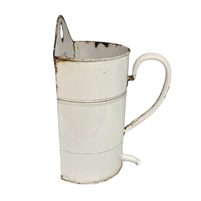 A vintage white enamel pitcher with a distressed finish, featuring rusted details and a small metal spout, isolated on a white background.