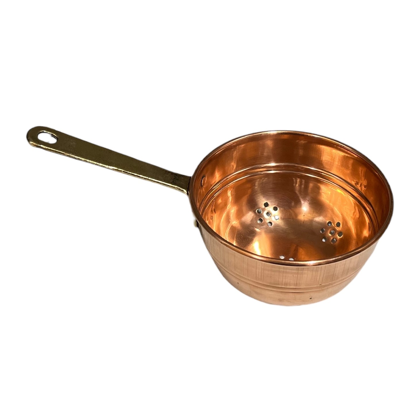Small copper French sieve with a brass handle on a white background