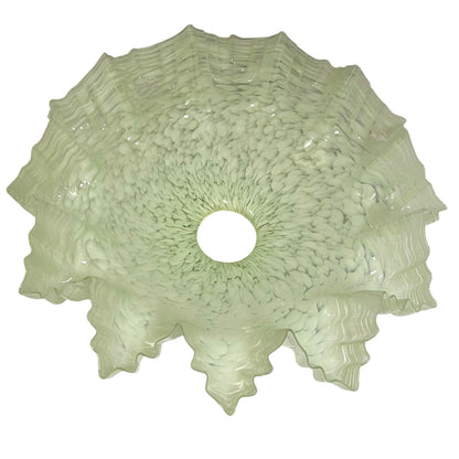 A light green textured glass shade or bowl with a scalloped, ruffled edge and a circular cutout in the center, shown against a plain white background.