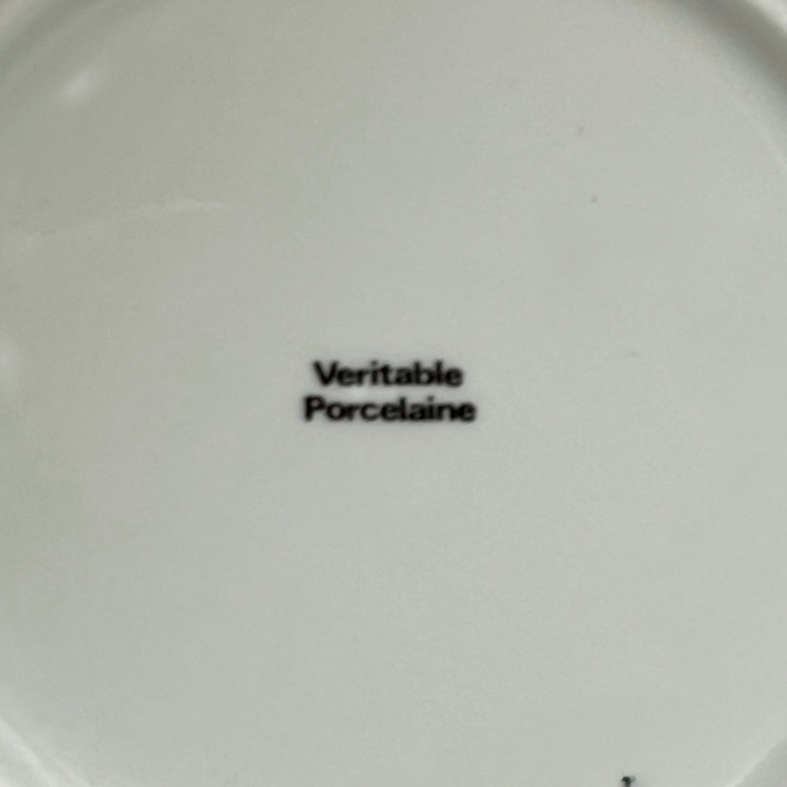 White plate with 'Veritable Porcelaine' text on a white background