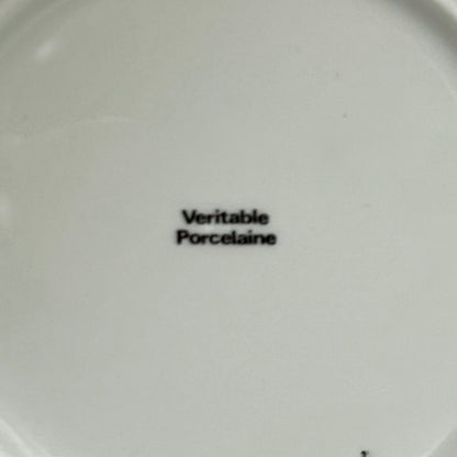 White plate with 'Veritable Porcelaine' text on a white background