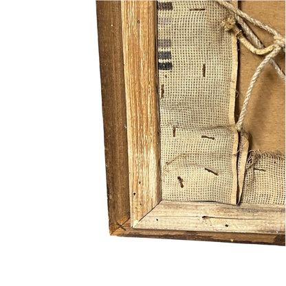Close-up detail of the back corner of a rustic wooden framed canvas, showing the natural wood frame, burlap fabric, and hanging rope against a white background.