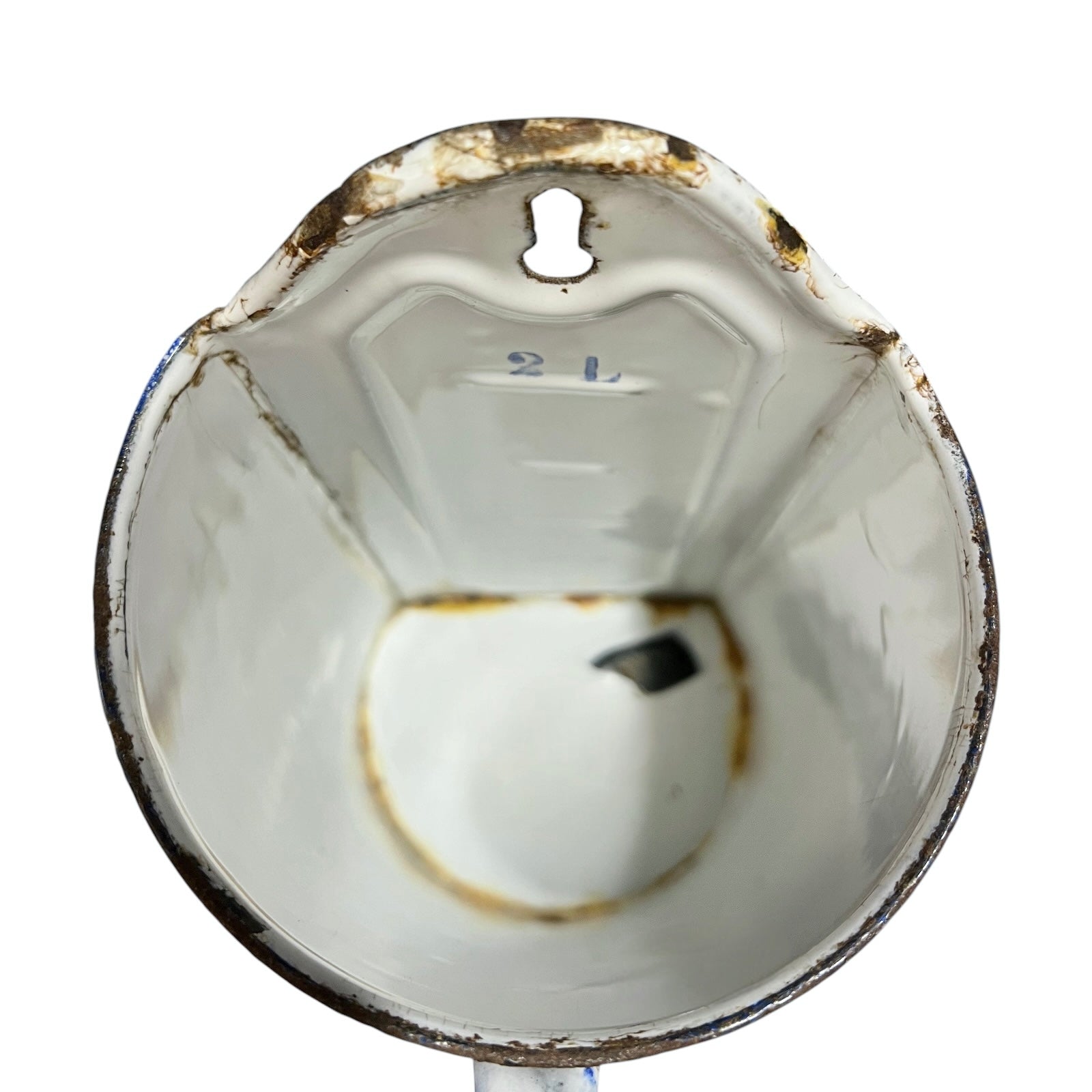 Close up the inner of a vintage French enamel irrigator