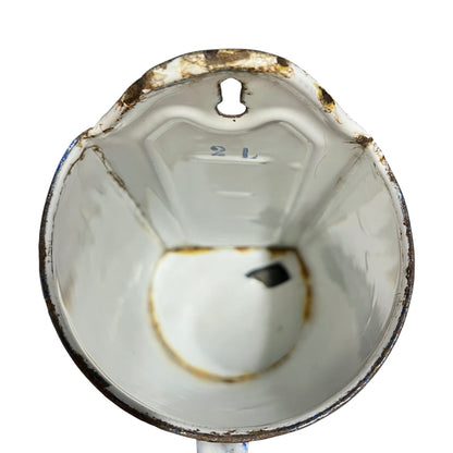 Close up the inner of a vintage French enamel irrigator