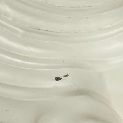 Close up of a Vintage-style light fixture with frosted glass shade on a white background