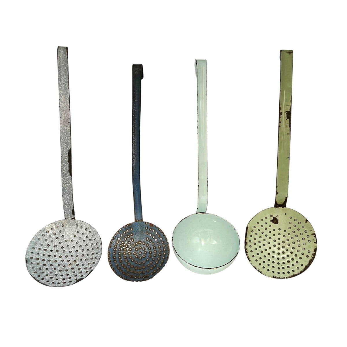 Four vintage metal kitchen ladles with perforated holes and long handles, shown side by side against a plain white background.