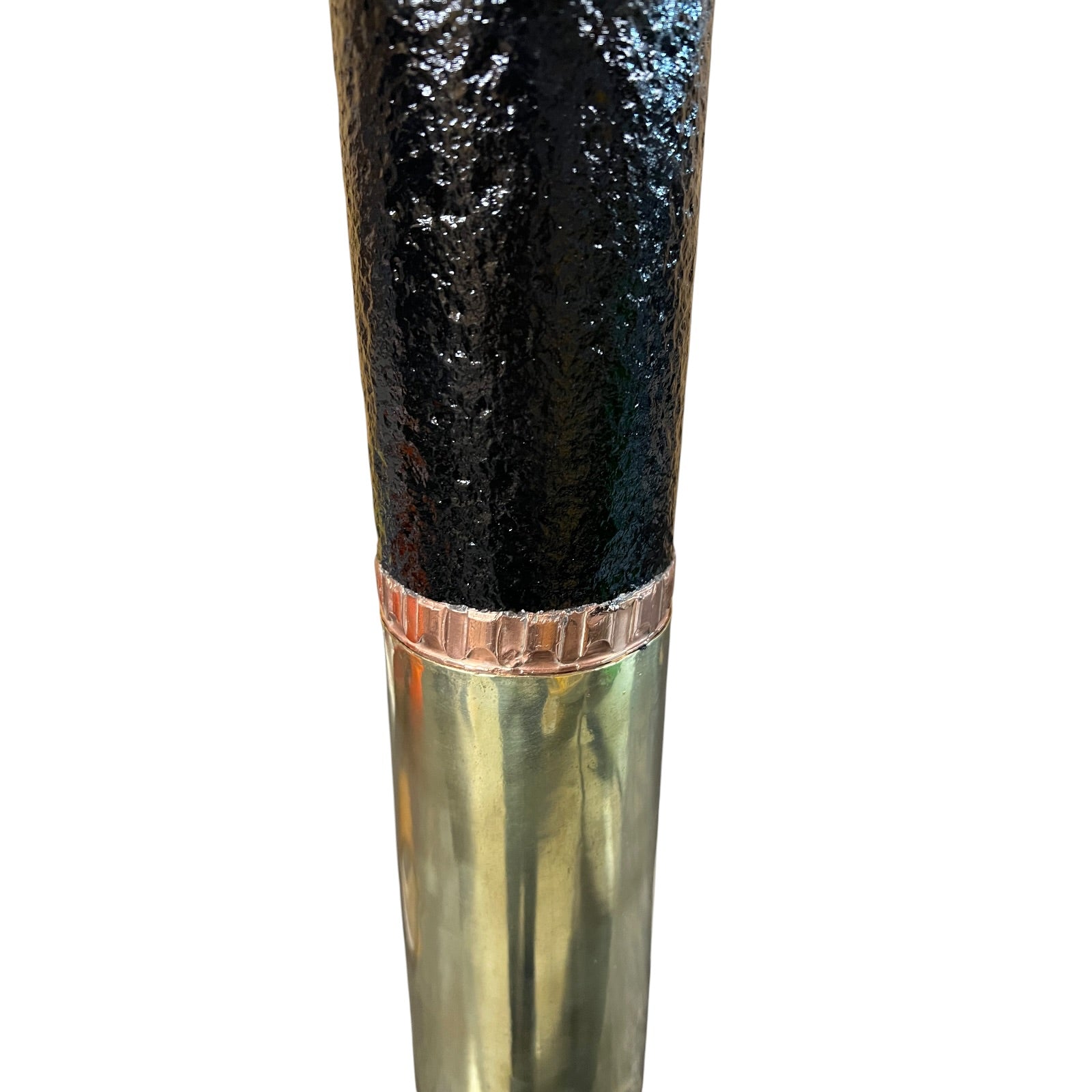 Close up of a  decorative British WW1 18 pounder with a brass base, black mid section on a white background