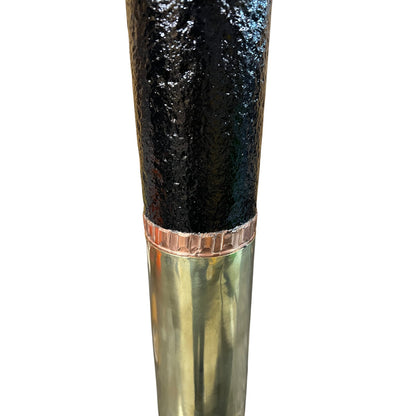 Close up of a  decorative British WW1 18 pounder with a brass base, black mid section on a white background