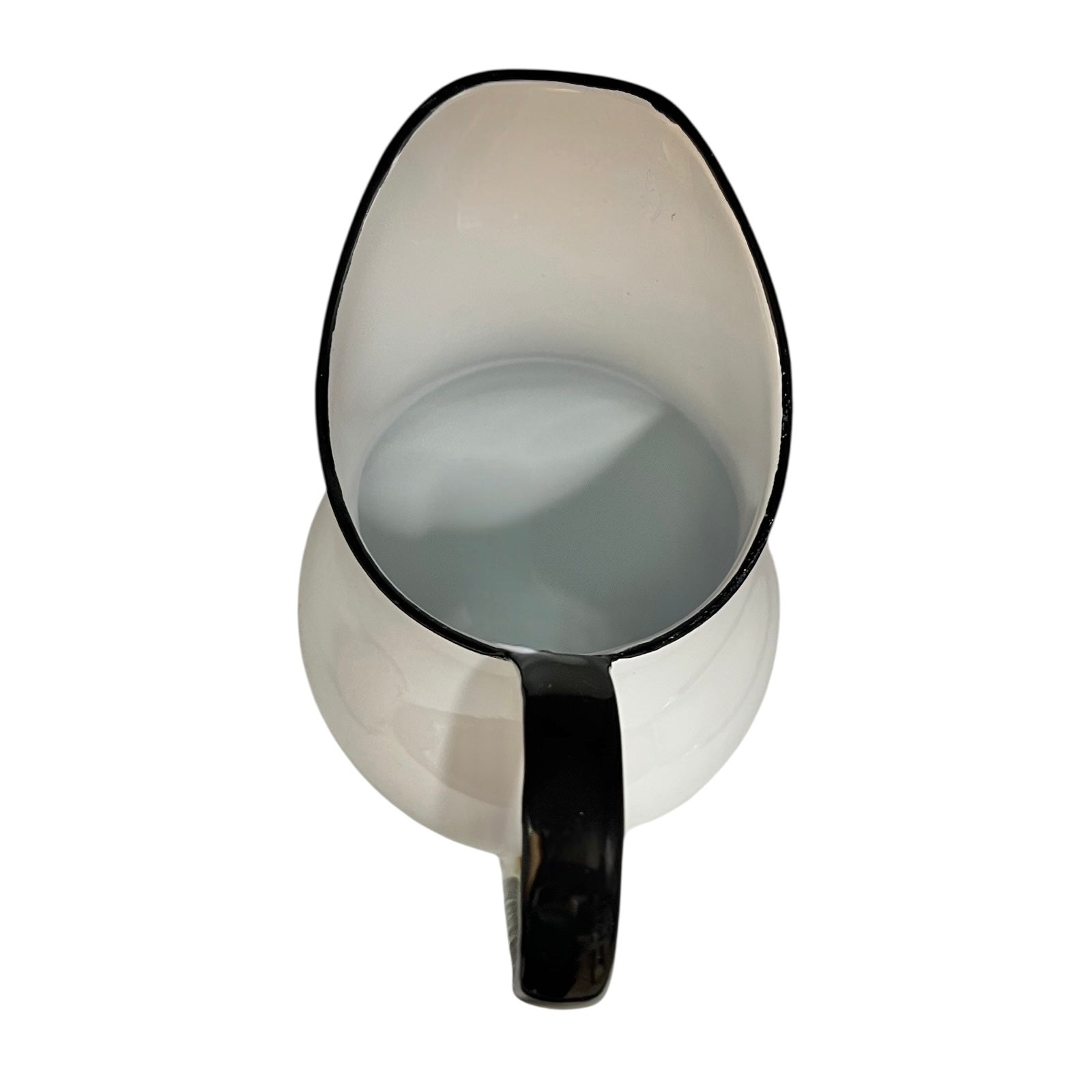 White pitcher with black handle and rim on a white background