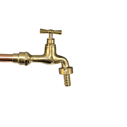 Brass faucet on a white background