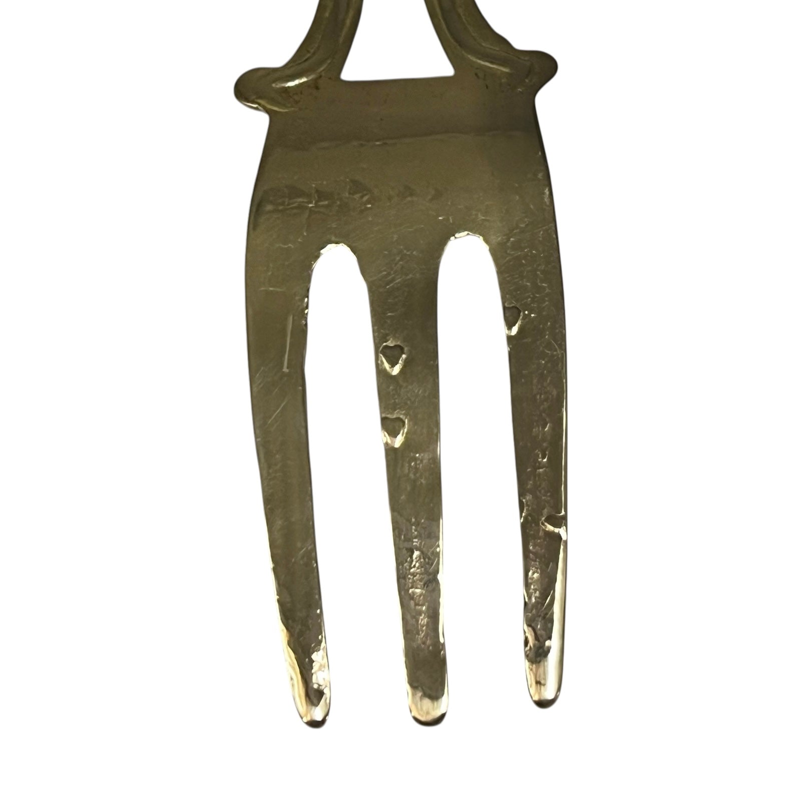 Brass vintage fork on a white 
background