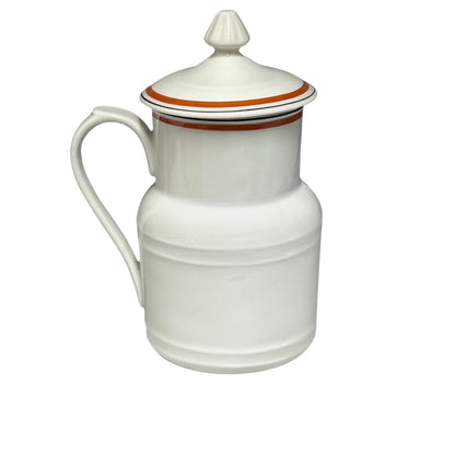 White ceramic pitcher with a lid on a white background