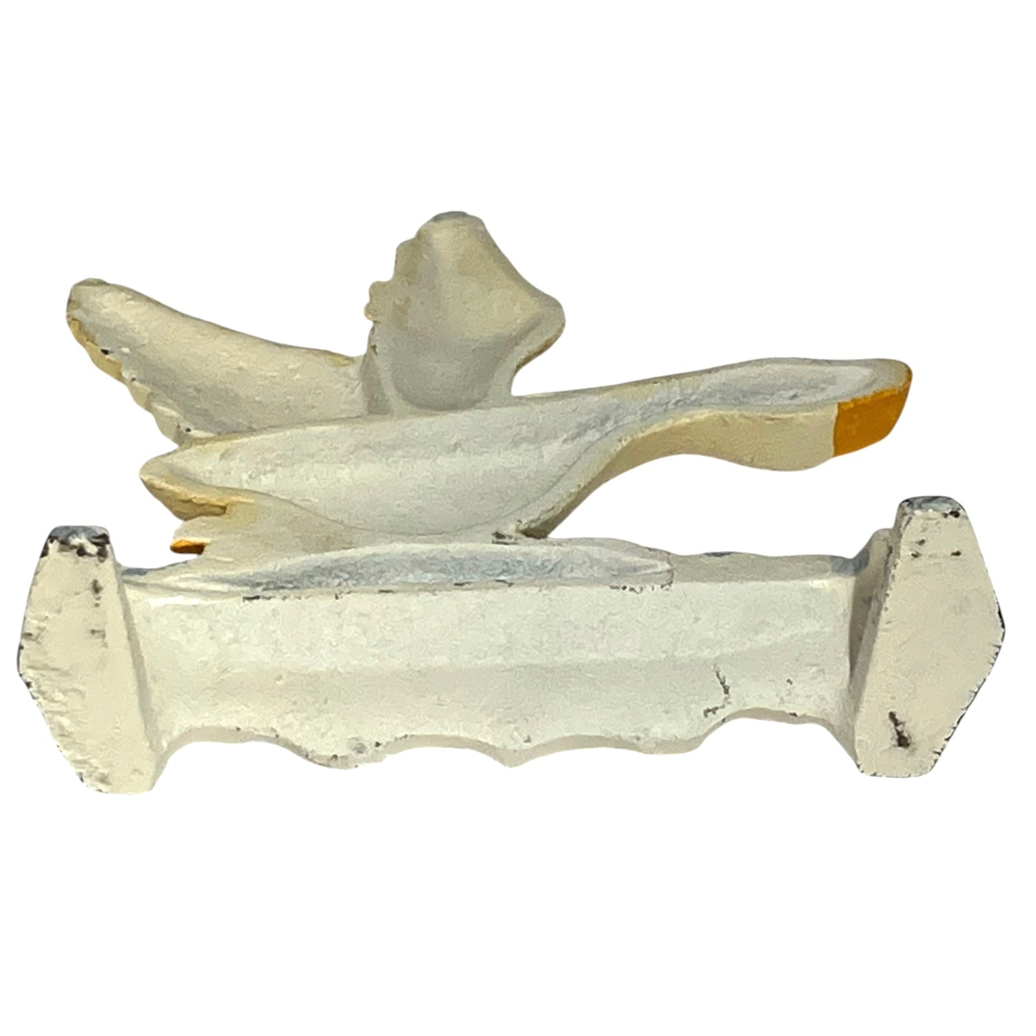 A vintage white-painted metal bird-shaped ornament or decorative piece, shown against a plain white background.