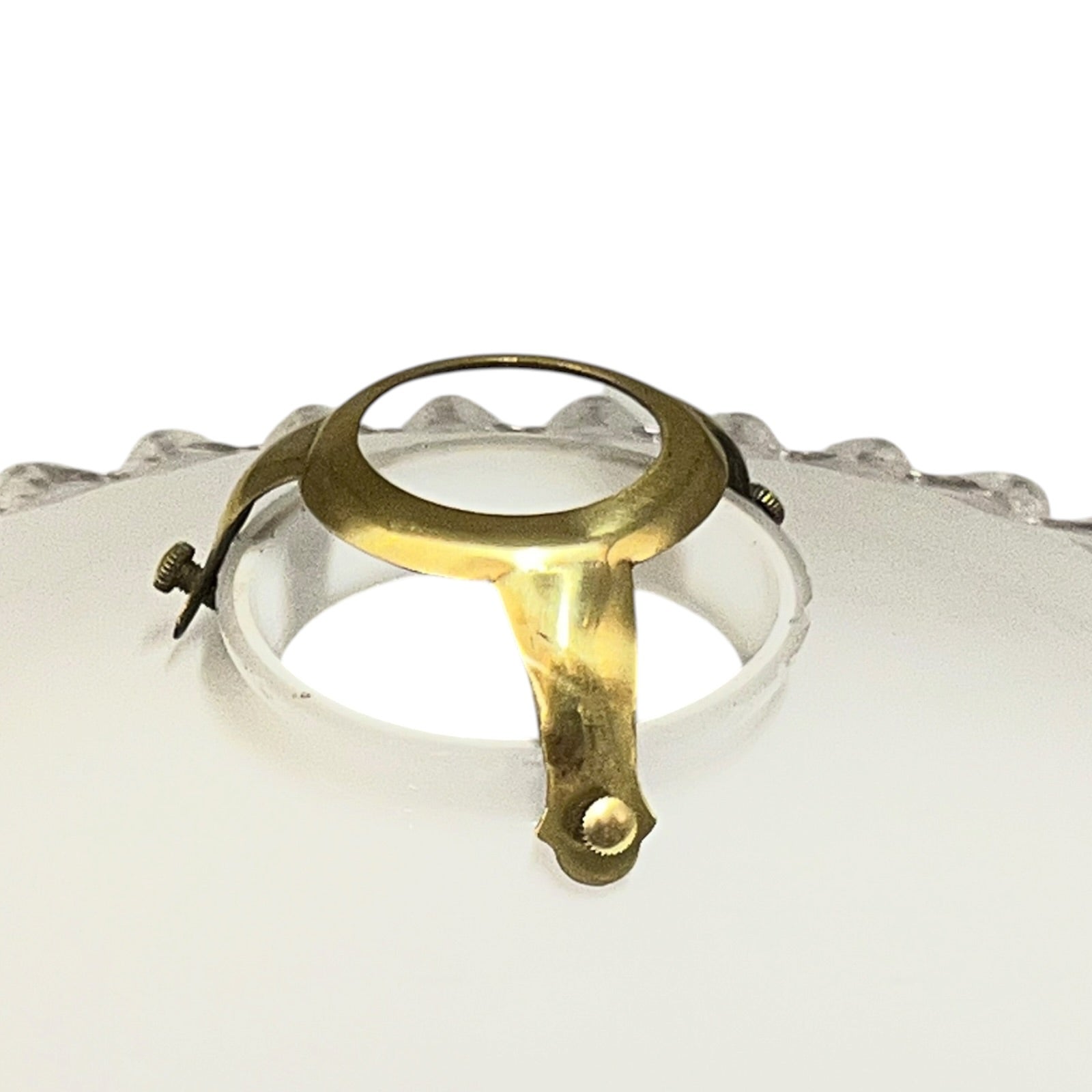 Vintage-style light fixture with brass fitting on a white background