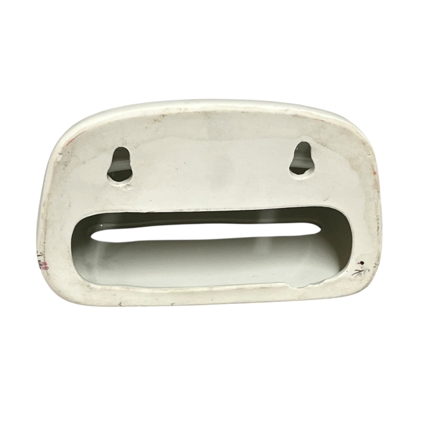 The back of a toiler tissue holder shown against a plain white background.