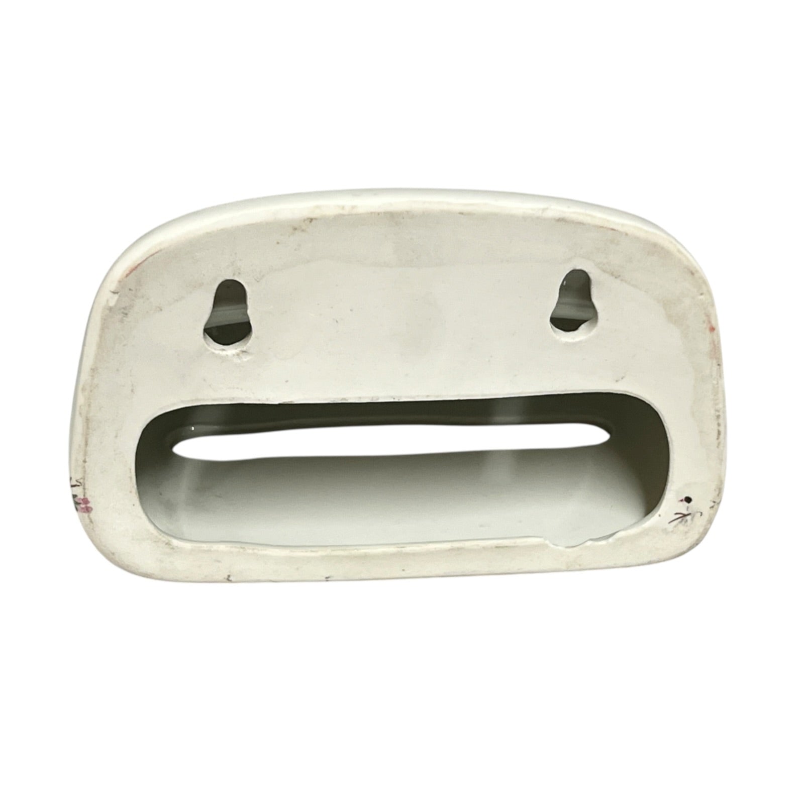 The back of a toiler tissue holder shown against a plain white background.
