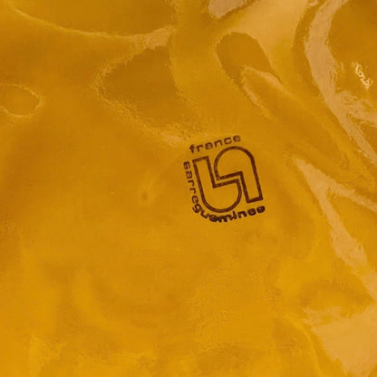 Back of fondue plate showing makers stamp on a white background