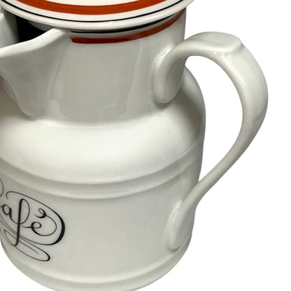 White ceramic pitcher with 'cafe' inscription on a white background