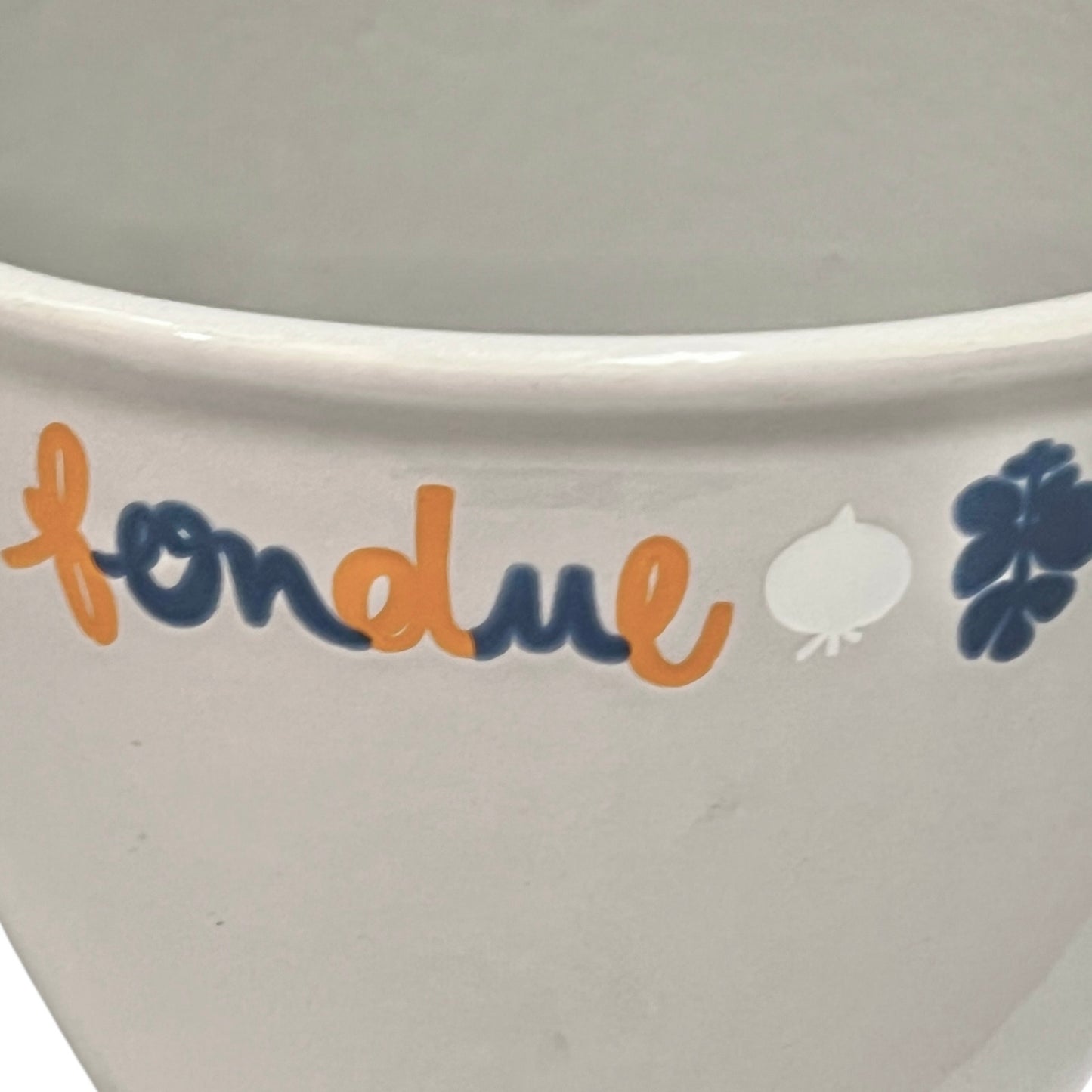 Close up of fondue pan on a white background