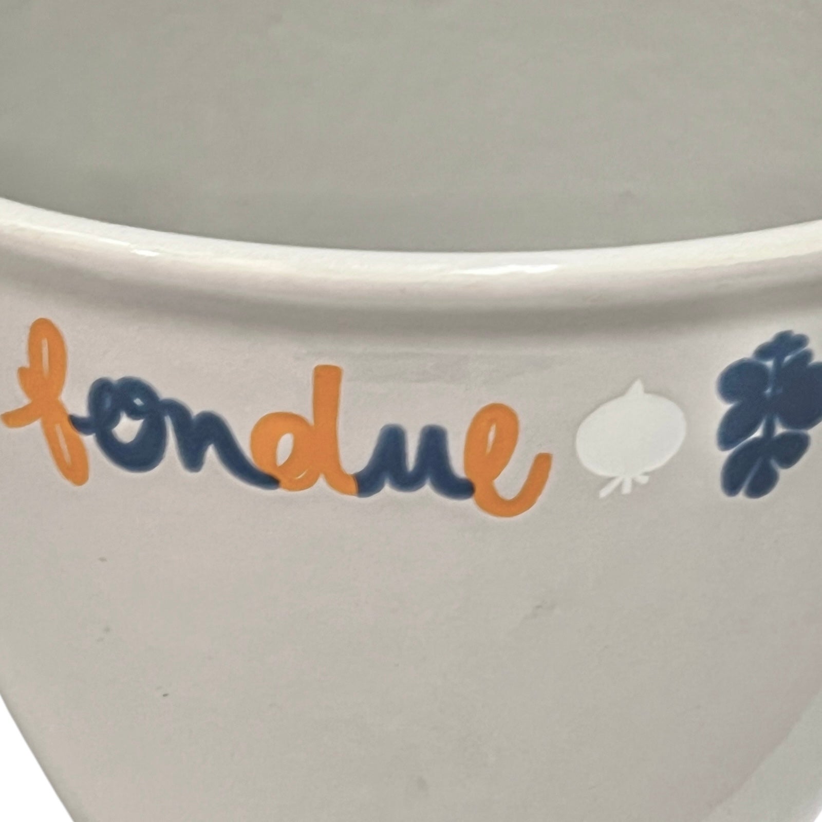 Close up of fondue pan on a white background